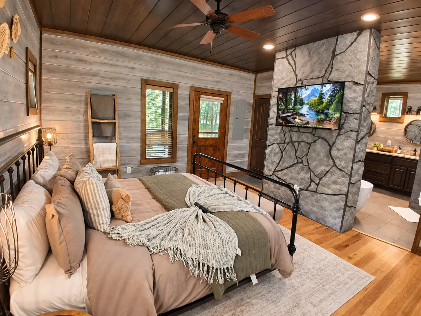 Primary king bedroom with fireplace at The Rustic Reserve